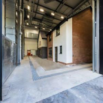 Open loading bays of Chamber one Energy House 2.0 showing the two houses constructed within