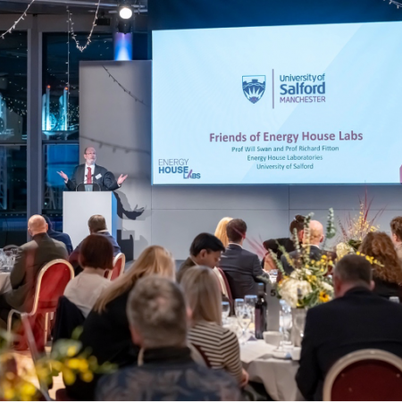 Professor Will Swan giving a speech to a seated audience at the 2024 Friends of Energy House Labs dinner