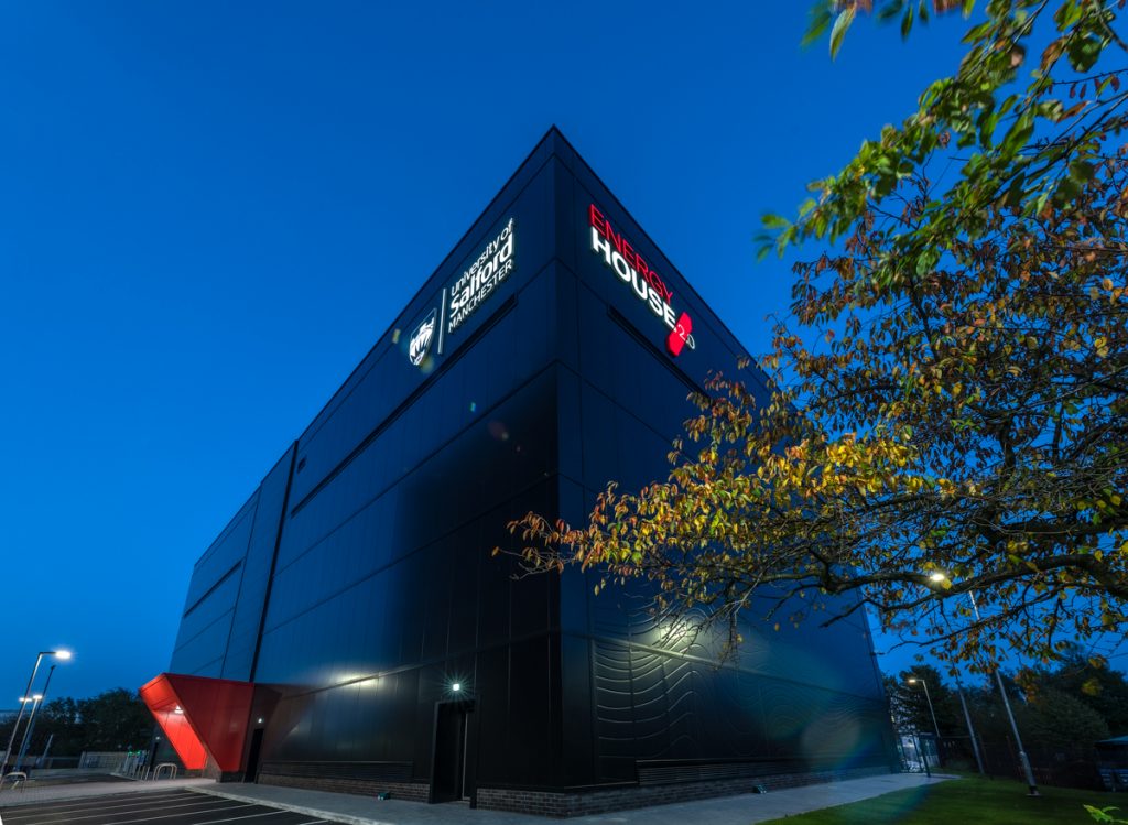 External image of the University of Salford's Energy House 2.0 facility in the early evening light