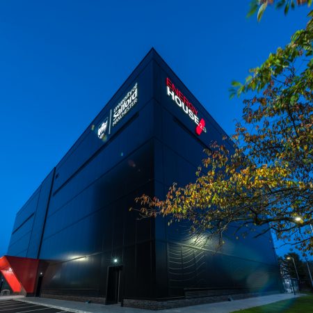 External image of the University of Salford's Energy House 2.0 facility in the early evening light